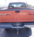 dodge ram 1500 2001 orange slt gasoline 8 cylinders 4 wheel drive automatic 32401