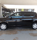 nissan versa 2011 dk  brown hatchback 1 8 s gasoline 4 cylinders front wheel drive automatic with overdrive 77477
