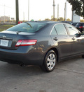 toyota camry 2011 gray sedan le 4 cylinders automatic with overdrive 77074