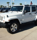 jeep wrangler unlimited 2010 white suv sahara gasoline 6 cylinders 4 wheel drive automatic 77065