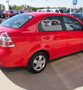 chevrolet aveo 2011 red sedan lt 4 cylinders automatic with overdrive 77802