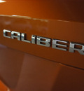 dodge caliber 2011 orange hatchback mainstreet gasoline 4 cylinders front wheel drive automatic 75219