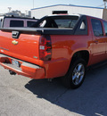 chevrolet avalanche 2009 orange suv lt 8 cylinders automatic 75062