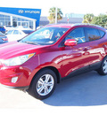 hyundai tucson 2013 dk  red gls gasoline 4 cylinders front wheel drive automatic 77074