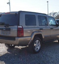 jeep commander 2006 tan suv gasoline 6 cylinders 4 wheel drive not specified 27569