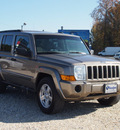 jeep commander 2006 tan suv gasoline 6 cylinders 4 wheel drive not specified 27569