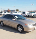 toyota camry 2004 tan sedan le 4 cylinders automatic with overdrive 76108