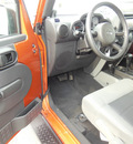 jeep wrangler 2010 orange suv sport gasoline 6 cylinders 4 wheel drive automatic 56001