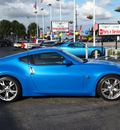 nissan 370z 2009 blue coupe gasoline 6 cylinders rear wheel drive manual 33021