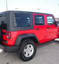 jeep wrangler unlimited 2011 red suv sport gasoline 6 cylinders 4 wheel drive automatic 76011