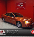 pontiac grand am 2004 orange coupe gt gasoline 6 cylinders front wheel drive automatic 76116