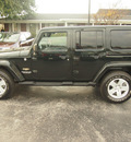 jeep wrangler unlimited 2012 black suv sahara gasoline 6 cylinders 4 wheel drive automatic 77074