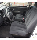 nissan versa 2012 white hatchback 1 8 s gasoline 4 cylinders front wheel drive 6 speed manual 78520