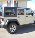 jeep wrangler unlimited 2011 cream suv rubic gasoline 6 cylinders 4 wheel drive automatic 79925