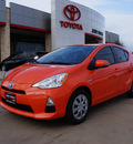 toyota prius c 2013 orange hatchback two hybrid 4 cylinders front wheel drive automatic 76049