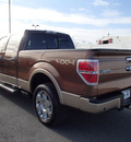 ford f 150 2012 brown lariat gasoline 6 cylinders 4 wheel drive automatic with overdrive 99352