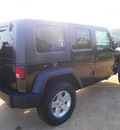 jeep wrangler unlimited 2010 black suv sport gasoline 6 cylinders 4 wheel drive automatic 77375