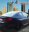 bmw m6 2015 black coupe gasoline 8 cylinders rear wheel drive 7 speed 77002